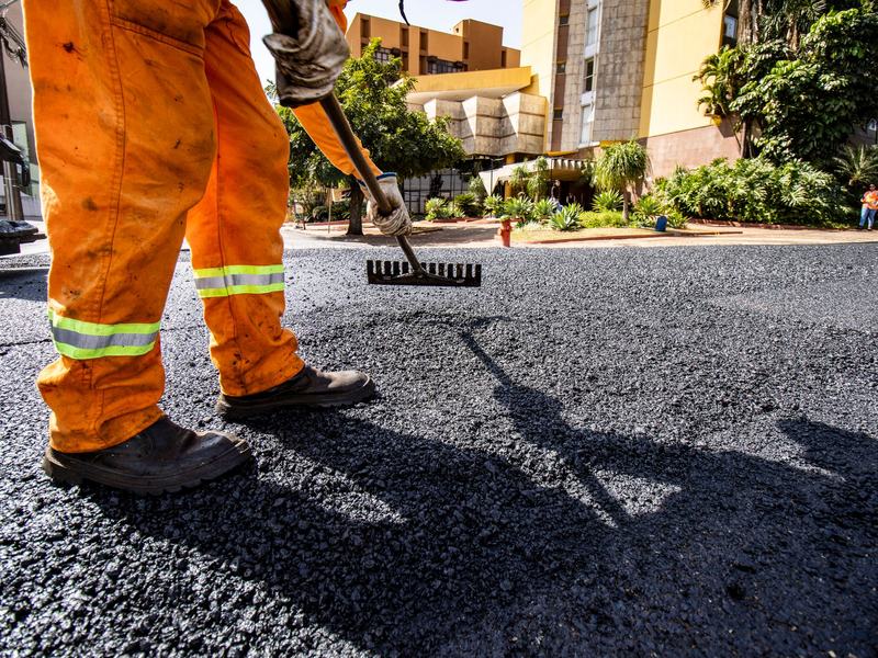 Asphalt paving and sealcoating crew working near Bloomington